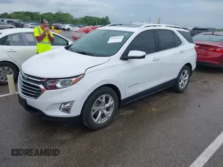 2021 Chevrolet Equinox Premier with VIN 3GNAXNEV5MS160043, listed as a IAAI auction lot 42109564 with 36,808 mi miles and . Bid and sale history available at DreamBid. Image 18.