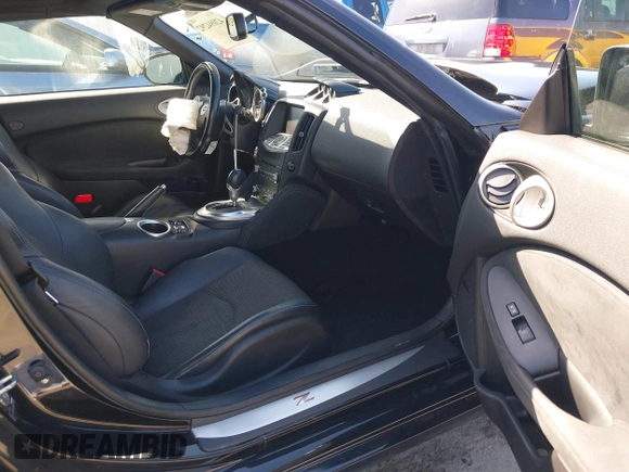2014 Nissan 370Z Touring with VIN JN1AZ4FH8EM620208, listed as a IAAI auction lot 42094292 with 68,799 mi miles and . Bid and sale history available at DreamBid. Image 5.