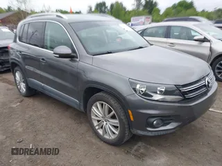 2012 Volkswagen Tiguan SE z VIN WVGAV7AX9CW000568, wystawiony jako IAAI lot #42322456 z przebiegiem 175 453 mil mil oraz . Historia ofert i sprzedaży dostępna na DreamBid. Obrazek 1.