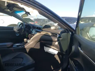 2018 Toyota Camry LE z VIN 4T1B11HK4JU151656, wystawiony jako IAAI lot #41524694 z przebiegiem 52 581 mil mil oraz . Historia ofert i sprzedaży dostępna na DreamBid. Obrazek 5.