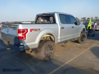 2018 Ford F-150 XL with VIN 1FTEW1E57JFC31779, listed as a IAAI auction lot 41784467 with 142,676 mi miles. Bid and sale history available at carsss.com. Image 4.