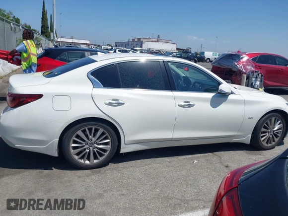2019 Infiniti Q50 Luxe z VIN JN1EV7AP7KM518276, wystawiony jako IAAI lot #42148033 z przebiegiem 56 720 mil mil oraz . Historia ofert i sprzedaży dostępna na DreamBid. Obrazek 13.