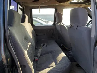 2000 Nissan Frontier XE z VIN 1N6ED27Y2YC369211, wystawiony jako Copart lot #80594884 z przebiegiem 225 194 mil mil oraz Czysty tytuł • Clean title. Historia ofert i sprzedaży dostępna na DreamBid. Obrazek 10.