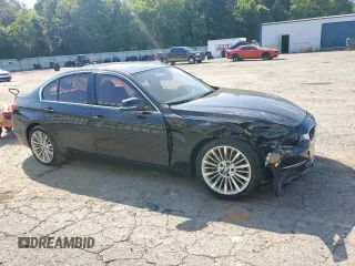 2012 BMW 3 Series 328i with VIN WBA3A5C58CF348710, listed as a Copart auction lot 61266815 with 112,720 mi miles and Salvage title. Bid and sale history available at DreamBid. Image 4.