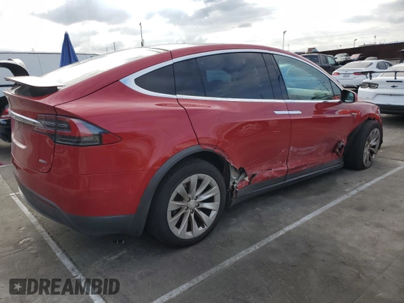 2016 Tesla Model X 70D with VIN 5YJXCAE28GF002399, listed as a Copart auction lot 50884225 with 73,113 mi miles and Salvage Title. Bid and sale history available at DreamBid. Image 3.