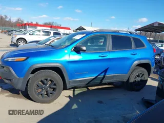 2018 Jeep Cherokee Trailhawk with VIN 1C4PJMBX7JD507453, listed as a IAAI auction lot 41464420 with 100,369 mi miles and . Bid and sale history available at DreamBid. Image 14.