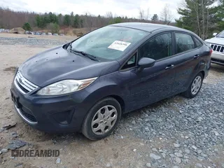 2012 Ford Fiesta SE with VIN 3FADP4BJ3CM152310, listed as a IAAI auction lot 42028398 with 124,530 mi miles and . Bid and sale history available at DreamBid. Image 2.