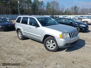 2010 Jeep Grand Cherokee Laredo with VIN 1J4PS4GK2AC155683, listed as a IAAI auction lot 41411133 with 211,803 mi miles. Bid and sale history available at carsss.com. Image 1.