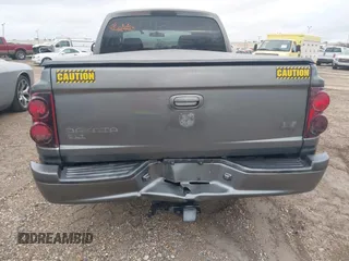 2005 Dodge Dakota SLT with VIN 1D7HE48N05S293699, listed as a IAAI auction lot 41541498 with 166,159 mi miles and . Bid and sale history available at carsss.com. Image 6.