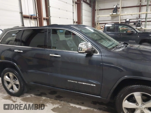 2014 Jeep Grand Cherokee Overland with VIN 1C4RJFCT9EC234270, listed as a IAAI auction lot 41938621 with 144,541 mi miles and . Bid and sale history available at DreamBid. Image 13.