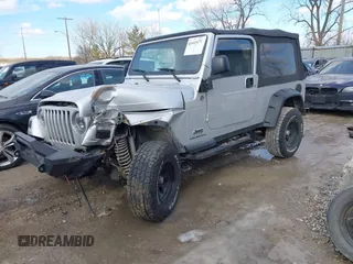 2005 Jeep Wrangler Unlimited with VIN 1J4FA44S25P340852, listed as a IAAI auction lot 41441671 with 139,302 mi miles. Bid and sale history available at carsss.com. Image 2.