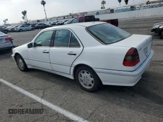 2000 Mercedes-Benz C 230 Kompressor with VIN WDBHA24G1YA820238, listed as a Copart auction lot 55563994 with 264,556 mi miles and Salvage Title. Bid and sale history available at carsss.com. Image 2.