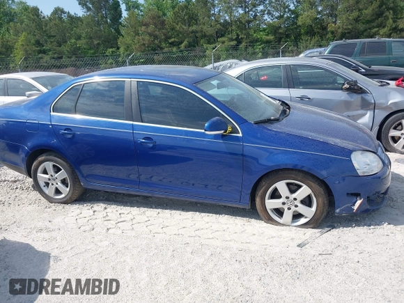 2009 Volkswagen Jetta SE z VIN 3VWRZ71K99M159242, wystawiony jako IAAI lot #42200917 z przebiegiem 226 285 mil mil oraz . Historia ofert i sprzedaży dostępna na DreamBid. Obrazek 14.