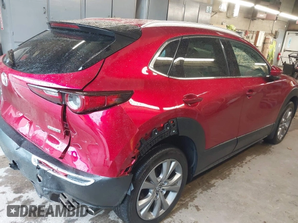 2023 Mazda CX-30 S Premium with VIN 3MVDMBDM5PM518612, listed as a IAAI auction lot 42219265 with 29,135 mi miles and . Bid and sale history available at DreamBid. Image 4.