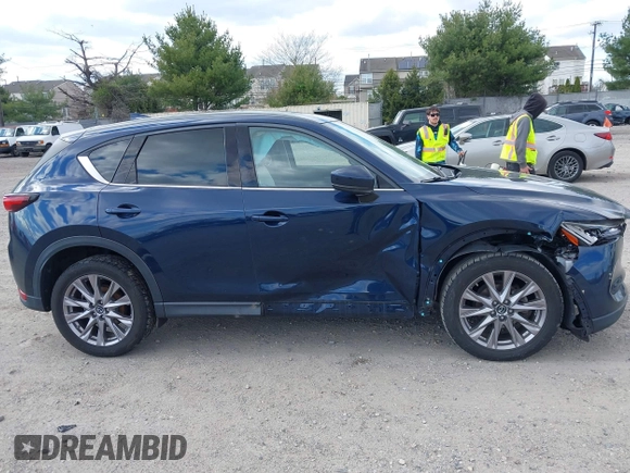 2019 Mazda CX-5 Grand Touring with VIN JM3KFBDM2K0603400, listed as a IAAI auction lot 42051135 with 59,448 mi miles and . Bid and sale history available at DreamBid. Image 13.
