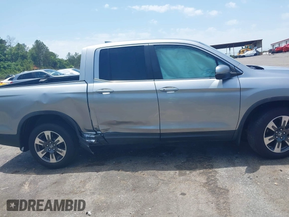 2018 Honda Ridgeline RTL z VIN 5FPYK2F5XJB001064, wystawiony jako IAAI lot #42252956 z przebiegiem 95 272 mil mil oraz . Historia ofert i sprzedaży dostępna na DreamBid. Obrazek 14.