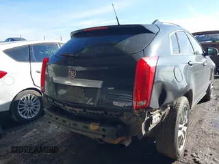 2014 Cadillac SRX Premium Collection z VIN 3GYFNDE34ES581728, wystawiony jako IAAI lot #41578226 z przebiegiem 121 118 mil mil oraz . Historia ofert i sprzedaży dostępna na DreamBid. Obrazek 6.