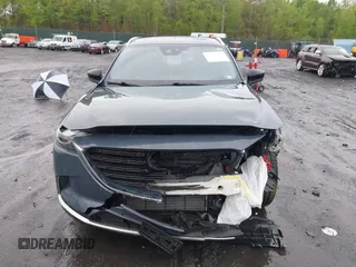 2021 Mazda CX-9 Grand Touring z VIN JM3TCBDY8M0528365, wystawiony jako IAAI lot #42222394 z przebiegiem 44 850 mil mil oraz . Historia ofert i sprzedaży dostępna na DreamBid. Obrazek 12.