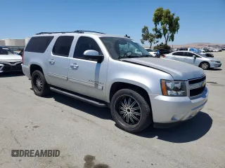 2013 Chevrolet Suburban LT with VIN 1GNSCJE09DR105725, listed as a Copart auction lot 61450935 with 171,659 mi miles and Salvage title. Bid and sale history available at DreamBid. Image 4.