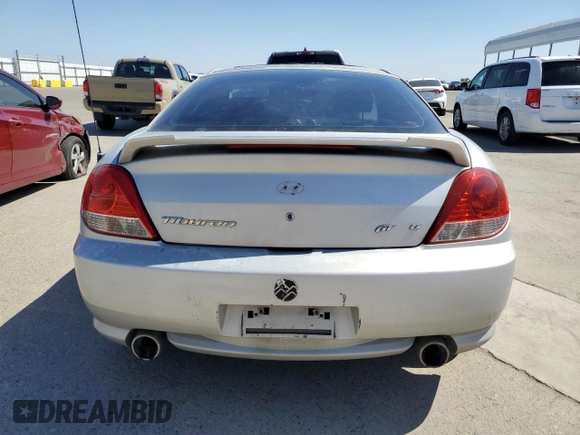 2006 Hyundai Tiburon GT z VIN KMHHN65F26U225506, wystawiony jako Copart lot #56997285 z przebiegiem 170 175 mil mil oraz Szkoda całkowita • Salvage title. Historia ofert i sprzedaży dostępna na DreamBid. Obrazek 6.