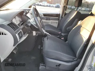 2010 Dodge Grand Caravan SXT with VIN 2D4RN5D16AR496795, listed as a Copart auction lot 83374834 with 99,902 mi miles and Salvage Title. Bid and sale history available at DreamBid. Image 7.