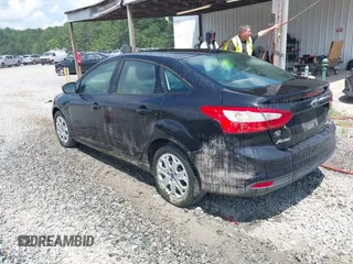 2012 Ford Focus SE with VIN 1FAHP3F21CL390012, listed as a IAAI auction lot 42634521 with 214,617 mi miles and . Bid and sale history available at DreamBid. Image 3.