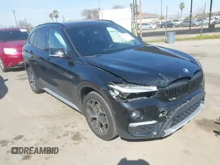 2017 BMW X1 sDrive28i z VIN WBXHU7C33H5H37901, wystawiony jako IAAI lot #41611443 z przebiegiem 103 647 mil mil oraz . Historia ofert i sprzedaży dostępna na DreamBid. Obrazek 1.