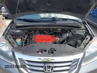 2010 Honda Odyssey Touring with VIN 5FNRL3H90AB053710, listed as a IAAI auction lot 42577646 with 255,351 mi miles and . Bid and sale history available at DreamBid. Image 10.