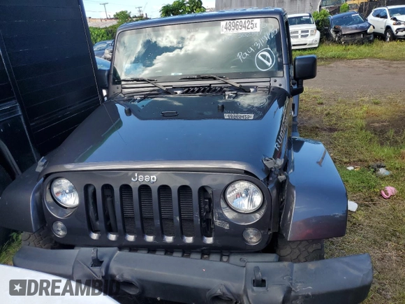 2014 Jeep Wrangler Unlimited Rubicon with VIN 1C4HJWFG7EL302897, listed as a Copart auction lot 48969425 with 57,976 mi miles and Salvage title. Bid and sale history available at DreamBid. Image 5.
