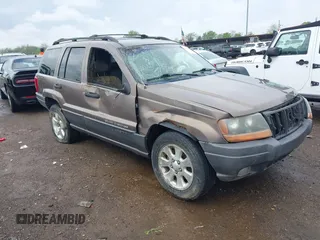 2001 Jeep Grand Cherokee Laredo z VIN 1J4GW48S61C563445, wystawiony jako IAAI lot #42178049 z przebiegiem 119 289 mil mil oraz . Historia ofert i sprzedaży dostępna na DreamBid. Obrazek 1.