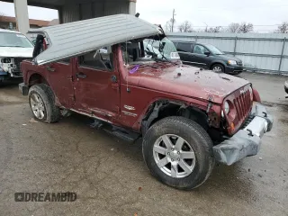 2010 Jeep Wrangler Unlimited Sahara with VIN 1J4BA5H10AL103638, listed as a Copart auction lot 48119645 with 0 mi miles and Salvage Title. Bid and sale history available at carsss.com. Image 4.