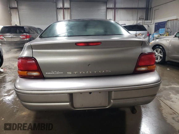 1999 Dodge Stratus z VIN 1B3EJ46X0XN690121, wystawiony jako Copart lot #83056374 z przebiegiem Nie podano mil oraz Szkoda całkowita • Salvage title. Historia ofert i sprzedaży dostępna na DreamBid. Obrazek 6.