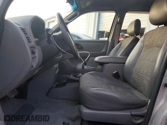 2002 Ford Escape XLS Choice with VIN 1FMYU01162KC61229, listed as a Copart auction lot 41985085 with 74,203 mi miles and Salvage title. Bid and sale history available at DreamBid. Image 7.