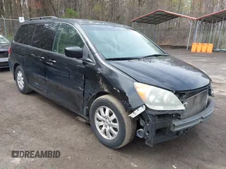 2009 Honda Odyssey EX-L with VIN 5FNRL387X9B051750, listed as a IAAI auction lot 41953221 with 205,142 mi miles. Bid and sale history available at carsss.com. Image 1.