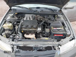 1999 Toyota Camry LE z VIN 4T1BF22K9XU081256, wystawiony jako IAAI lot #42208556 z przebiegiem 236 198 mil mil oraz . Historia ofert i sprzedaży dostępna na DreamBid. Obrazek 10.