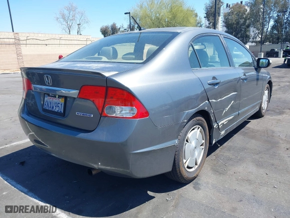 2010 Honda Civic Hybrid with VIN JHMFA3F29AS005350, listed as a IAAI auction lot 41966454 with 145,058 mi miles. Bid and sale history available at carsss.com. Image 4.