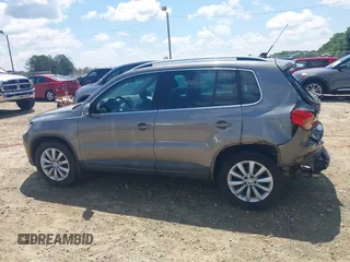 2011 Volkswagen Tiguan SEL z VIN WVGBV7AX5BW512203, wystawiony jako IAAI lot #42273838 z przebiegiem 157 072 mil mil oraz . Historia ofert i sprzedaży dostępna na DreamBid. Obrazek 14.