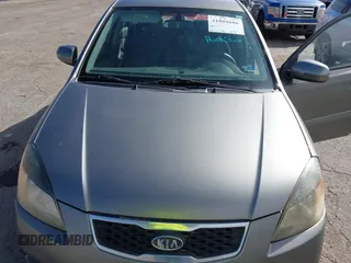 2010 Kia Rio LX with VIN KNADH4A34A6674027, listed as a IAAI auction lot 41804686 with 113,528 mi miles. Bid and sale history available at carsss.com. Image 10.