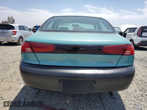 1999 Ford Escort LX with VIN 1FAFP10P6XW196483, listed as a Copart auction lot 59215635 with 74,859 mi miles and Salvage title. Bid and sale history available at DreamBid. Image 6.