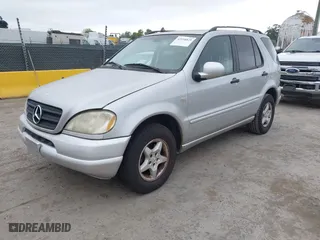 2001 Mercedes-Benz M-Class with VIN 4JGAB54E71A231597, listed as a IAAI auction lot 42058829 with 233,005 mi miles. Bid and sale history available at carsss.com. Image 2.