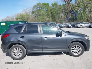 2016 Mazda CX-5 Touring z VIN JM3KE2CY4G0708972, wystawiony jako IAAI lot #42043013 z przebiegiem 157 573 mil mil oraz . Historia ofert i sprzedaży dostępna na DreamBid. Obrazek 13.
