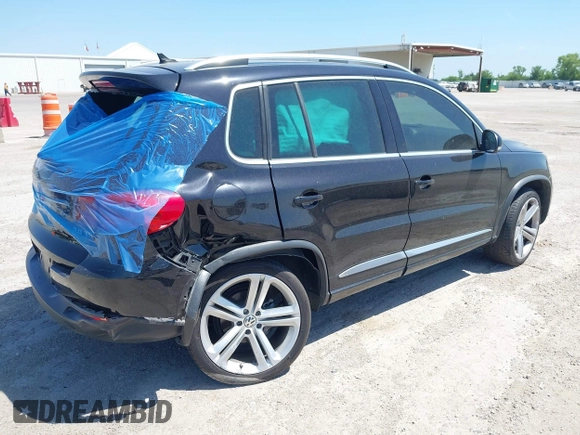 2014 Volkswagen Tiguan SEL with VIN WVGAV3AX4EW025339, listed as a IAAI auction lot 42313665 with 96,756 mi miles and . Bid and sale history available at DreamBid. Image 4.