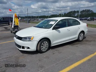 2014 Volkswagen Jetta Sedan S with VIN 3VW2K7AJ6EM334635, listed as a IAAI auction lot 42151738 with 142,923 mi miles. Bid and sale history available at carsss.com. Image 2.