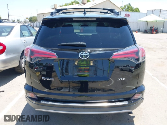 2018 Toyota RAV4 XLE with VIN 2T3WFREV2JW447623, listed as a IAAI auction lot 42410168 with 84,800 mi miles and . Bid and sale history available at DreamBid. Image 16.