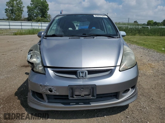 2007 Honda Fit Sport with VIN JHMGD38687S067648, listed as a Copart auction lot 64657345 with 123,055 mi miles and Salvage title. Bid and sale history available at DreamBid. Image 5.