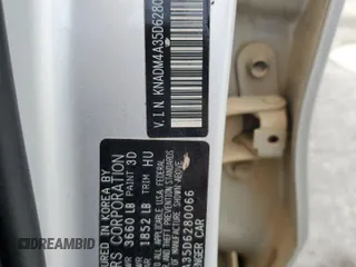 2013 Kia Rio LX z VIN KNADM4A35D6280066, wystawiony jako Copart lot #57293585 z przebiegiem 129 281 mil mil oraz Szkoda całkowita • Salvage title. Historia ofert i sprzedaży dostępna na DreamBid. Obrazek 13.