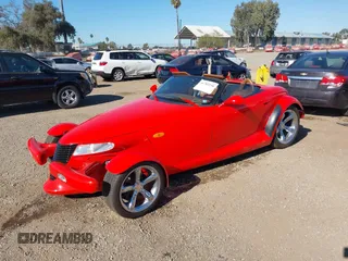 1999 Plymouth Prowler z VIN 1P3EW65G4XV503282, wystawiony jako IAAI lot #41282258 z przebiegiem 58 866 mil mil oraz . Historia ofert i sprzedaży dostępna na DreamBid. Obrazek 2.