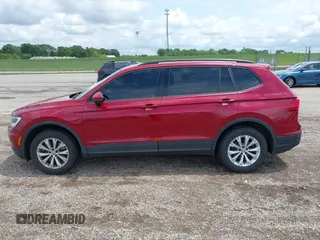 2018 Volkswagen Tiguan S with VIN 3VV1B7AX3JM045193, listed as a IAAI auction lot 42311886 with 69,049 mi miles and . Bid and sale history available at DreamBid. Image 14.