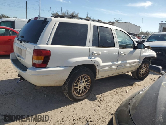 2002 Jeep Grand Cherokee Limited with VIN 1J4GX58S32C320843, listed as a Copart auction lot 77663864 with 289,537 mi miles and Salvage Title. Bid and sale history available at DreamBid. Image 3.