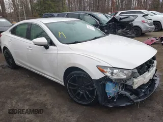 2015 Mazda 6 i Sport with VIN JM1GJ1U50F1220703, listed as a IAAI auction lot 41475129 with 127,834 mi miles. Bid and sale history available at carsss.com. Image 1.